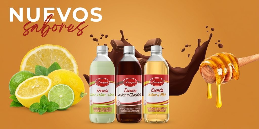 Tres botellas de esencias comestibles Levapan con los nuevos sabores de lima limón, chocolate y miel alineadas sobre un fondo naranja.